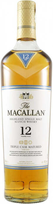 На фото изображение Macallan, Triple Cask Matured 12 Years Old, 0.7 L (Макаллан, Трипл Каск Мэтьюэд 12-летний в бутылках объемом 0.7 литра)
