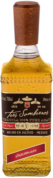 На фото изображение Tres Sombreros Tequila Anejo, 0.7 L (Трес Сомбрерос Аньехо объемом 0.7 литра)