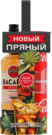 На фото изображение Bacardi Spiced, gift box with 2 Coca-Cola, 0.7 L (Бакарди Спайсд, в подарочной коробке с 2 банками Кока-Кола объемом 0.7 литра)